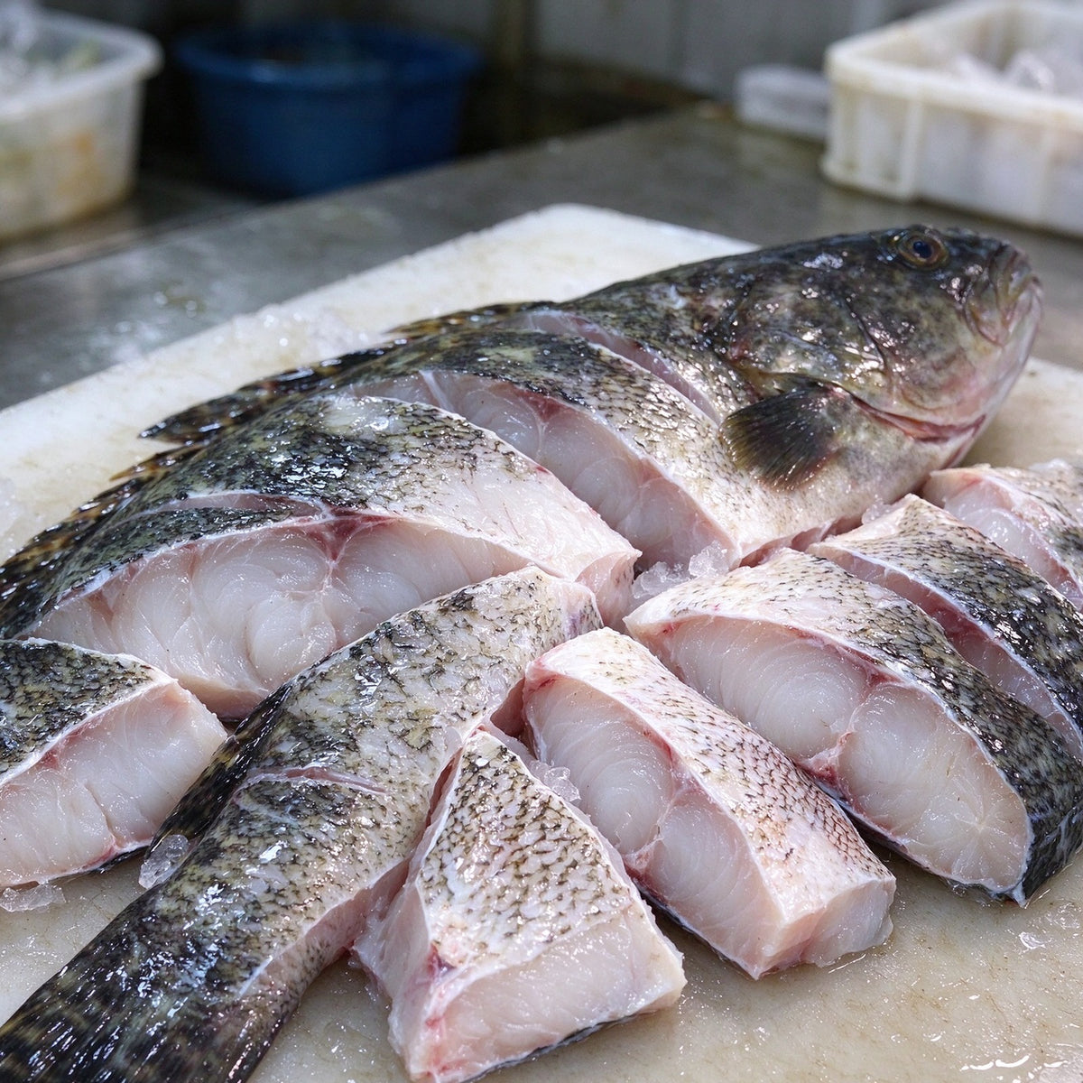 Whole steamed grouper garnished with scallion and chilli